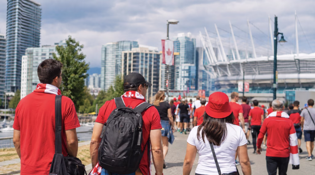 Soccer fans arriving in a Vancouver for a World Cup match walking toward bc place